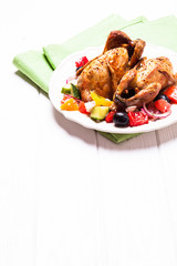 Baked quail with salad