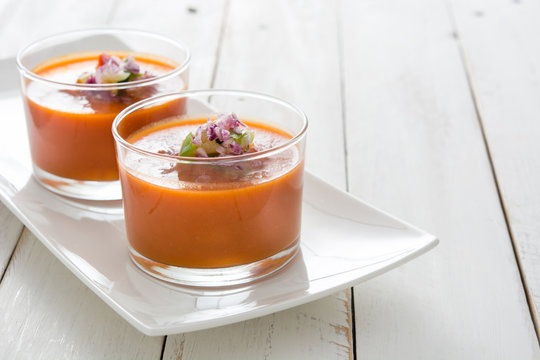 Gazpacho soup on white wooden table

