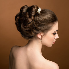 Beautiful sensual brunnete with elegant hairstyle. Wedding acces