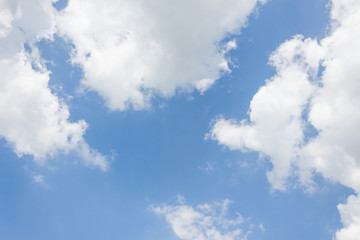 blue sky background is covered by white clouds