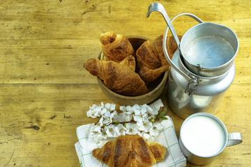 Aluminum milkcan witn organic milk and fresh baked croissants