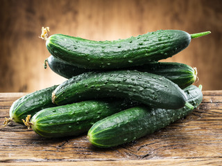 Cucumbers on the wooden table.