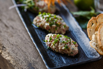 Fish tartare with herbs and carrot