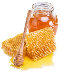 Jar full of fresh honey and honeycombs. High-quality picture.