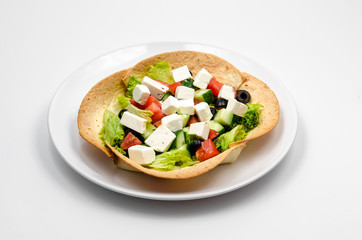 Greek salad on tortilla
