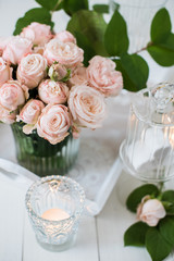 vintage wedding table decorations with roses, candles, cutlery a