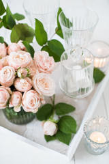 vintage wedding table decorations with roses, candles, cutlery a