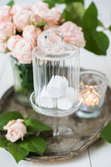 vintage wedding table decorations with roses, candles, cutlery a