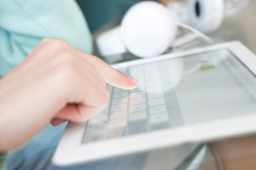 Hand touching screen on modern digital tablet pc.