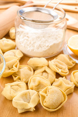 tortellini uncooked on wooden