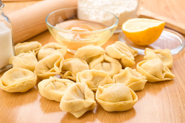 tortellini uncooked on wooden