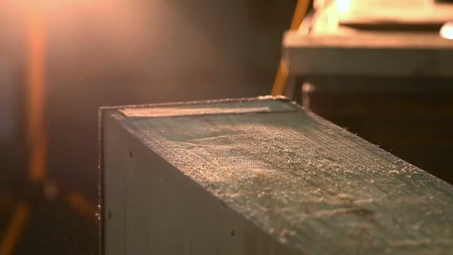 Carpenter polishing wood using electric grinder with polishing extender. close up