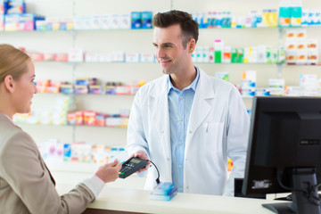 Pharmacist and client at pharmacy
