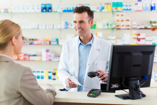 Pharmacist and client at pharmacy
