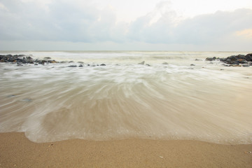 landscape of sea which have breakwater and cloudy sky on windy day ; Songkhla Thailand (slow shutter speeds)