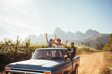 Group of young friends riding in pickup truck © Jacob Lund