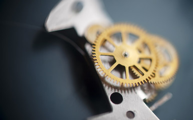 Clock mechanism macro shot with metal cogwheels.Conceptual photo for your successful business...