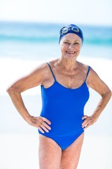 Pretty mature woman posing on the beach