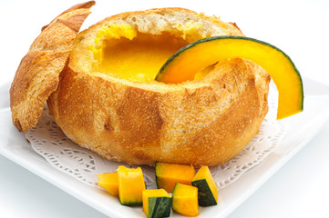 Pumpkin cream soup served in a loaf