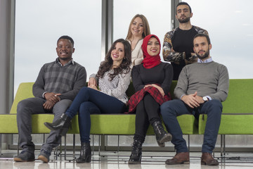 Fototapeta premium Group of students are hanging out in university hall, mixed-race