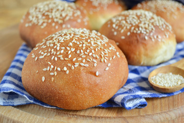 homemade buns with sesame seeds and milk for breakfast