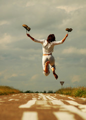 Girl jumps on the road