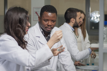 Fototapeta premium Group of young medical workers are working in lab as lab technic