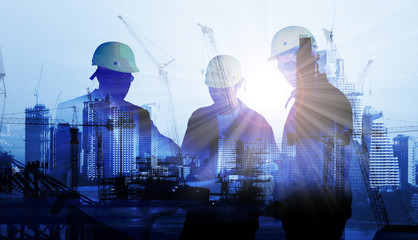 silhouette black man survey and civil engineer stand on ground working in a land building site over...