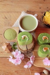 Obraz na płótnie Canvas Green tea cake roll and matcha green tea.