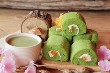 Green tea cake roll and matcha green tea.