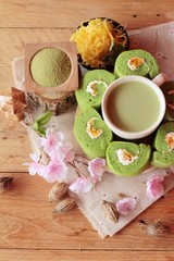 Green tea cake roll and matcha green tea.