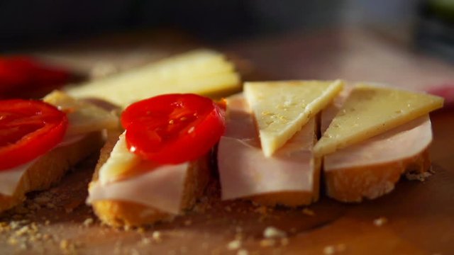 Slice tomato falling on sandwich with cheese and ham super slow motion, shot at 240fps
