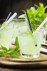 Green sweet cocktail with fresh mint and ice