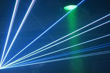 Fototapeta na wymiar Laser beam and spotlight during party event