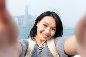 Woman taking the selfie in Hong Kong