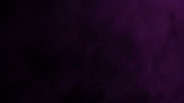 Movement of purple smoke on a black background. The concept of fight against smoking.
