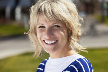 Portrait Of A Mature Woman Smiling At the Camera Outside