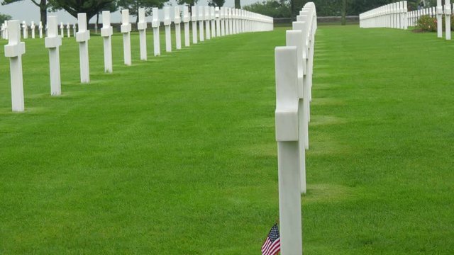 One of the cross has an American flaglet. Found in the cemetery of Normandy  that honors American troops who died in Europe during World War II.