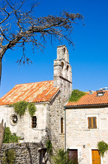 Church of Holy Virgin Mary and dry tree, center of old town Budva, Montenegro