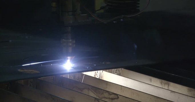A process of milling of the metal sheet. The machine draws a pattern on the sheet to be cut by another machine