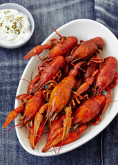 Boiled red crayfish with sauce . top view