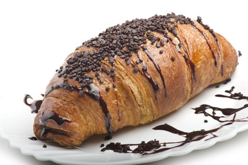 croissants with chocolate on a white plate