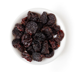 Bowl of raisins isolated on white, from above