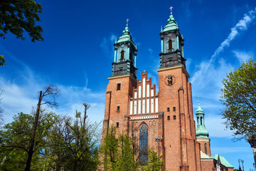 Towers of medieval Gothic cathedral in Poznan. - obrazy, fototapety, plakaty