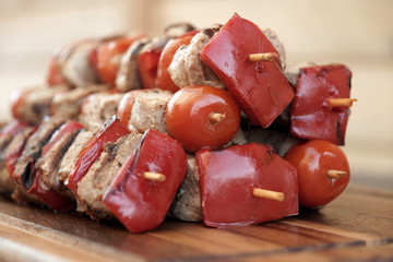 Stacked Skewered BBQ Shish Kebabs On The Wood Cutting Board