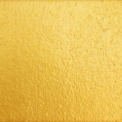 Shiny yellow gold wall texture background