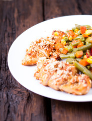 Mixed vegetables in a plate and chicken