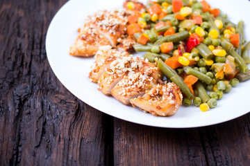 Mixed vegetables in a plate and chicken