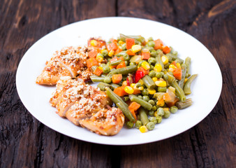 Mixed vegetables in a plate and chicken