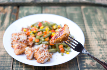 Mixed vegetables in a plate and chicken